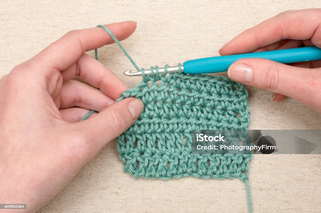 Crocheting Stitching Teal Yarn Knitting Hook Stock Photo - Download Image  Now - Crocheting, Crochet, Hand - iStock