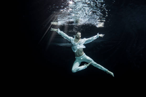 istock young male ballet dancer unerwater 649554900