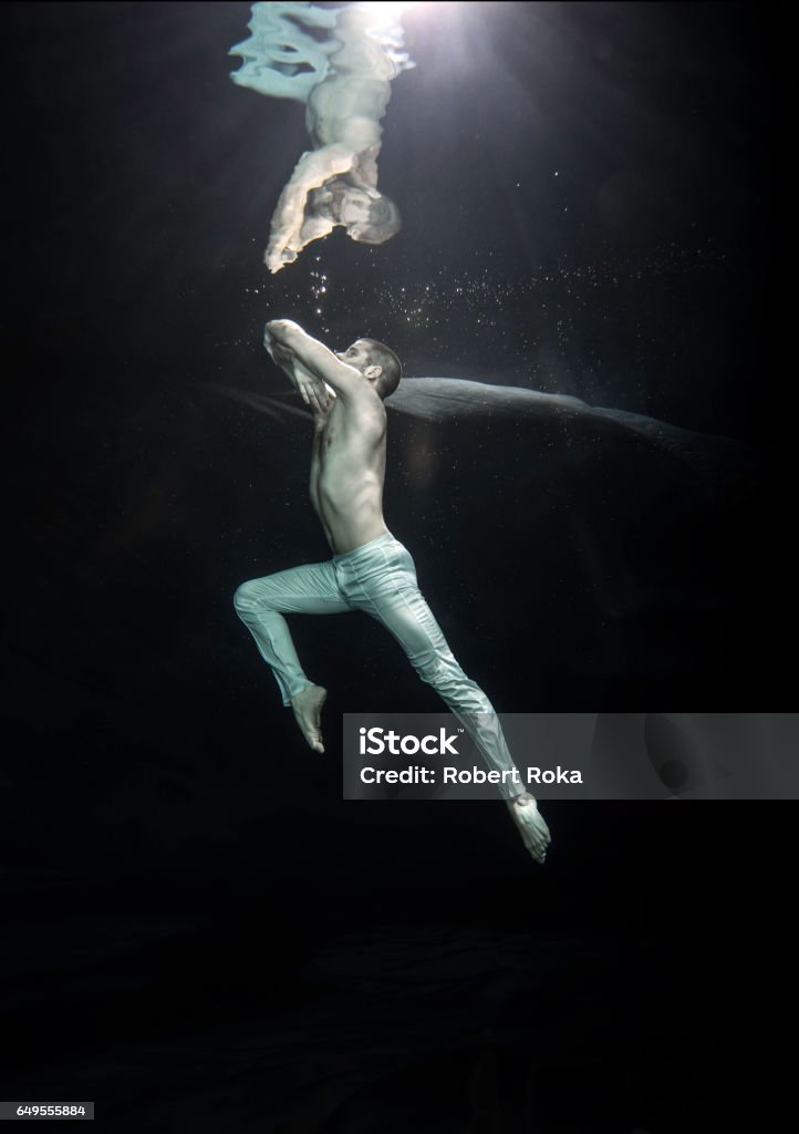 young male ballet dancer unerwater Underwater Stock Photo