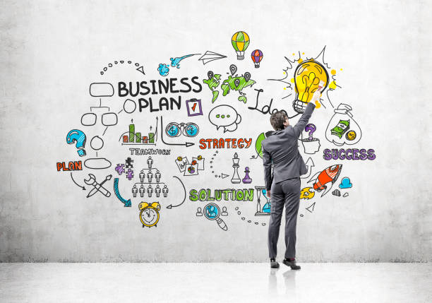 istock Man drawing colorful business plan sketch 649556264
