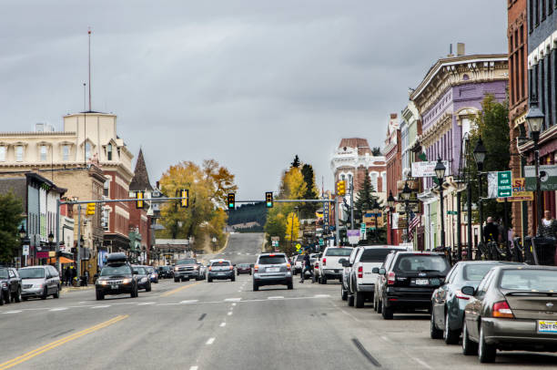 Main Street, Leadville, Colorado Leadville, Colorado, USA - September 30, 2015: Main Street runs through the town of Leadville, Colorado which was created in November 1859 when gold was discovered in California Gulch during the Pikes Peak Gold Rush. A former silver mining town that lies near the headwaters of the Arkansas River in the heart of the Rocky Mountains, the Leadville Historic District contains many historic structures and sites from its dynamic mining era. In the late 19th century, Leadville was the second most populous city in Colorado, after Denver. Situated at an elevation of 10,152 feet, Leadville is the highest incorporated city and the second highest incorporated municipality in the United States. leadville stock pictures, royalty-free photos & images