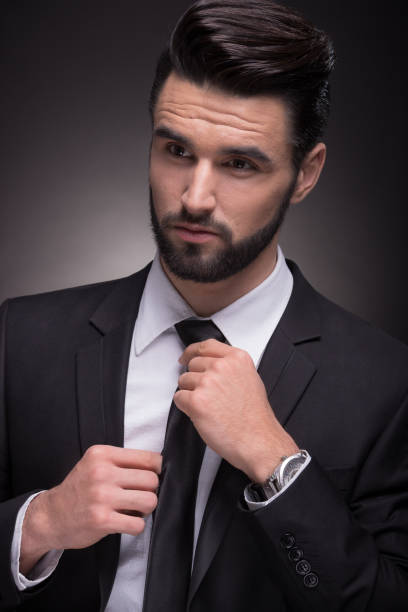 istock young man elegant necktie knot closeup 649569500