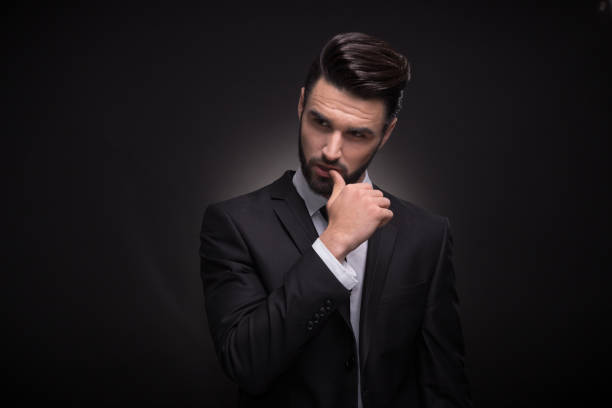 istock young man, upper body, handsome posing suit elegant 649569586