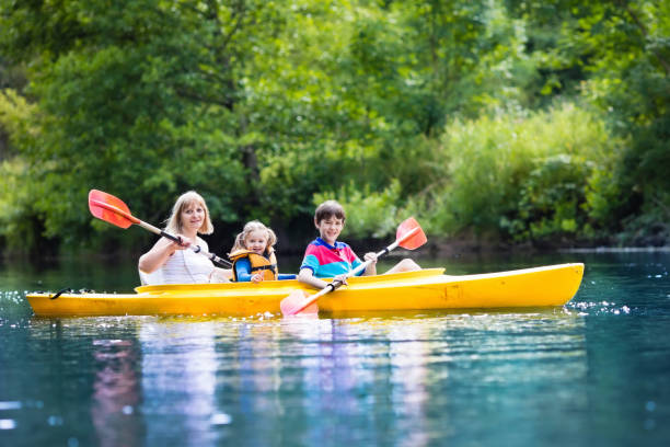 istock Family enjoying kayak ride on a river 649570286