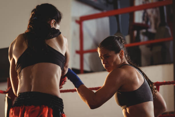 istock Two female boxers fighting in the ring 649570494