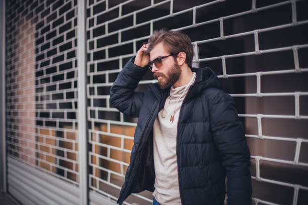istock Handsome fashion model outdoors 649573128