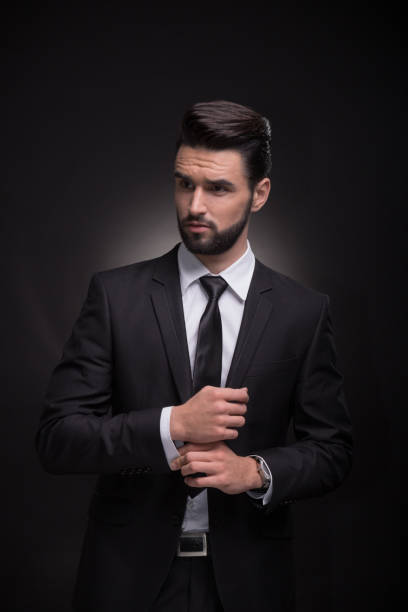 istock young man elegant suit cufflinks hands 649574046
