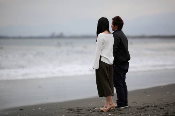 istock HIgh School Student Couple at Beach 649577764