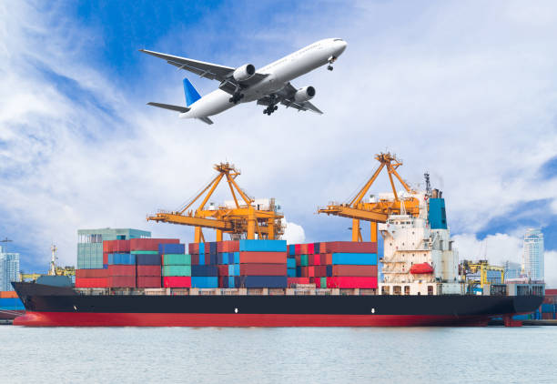 istock Cargo plane flying above ship port for logistic background 649580710