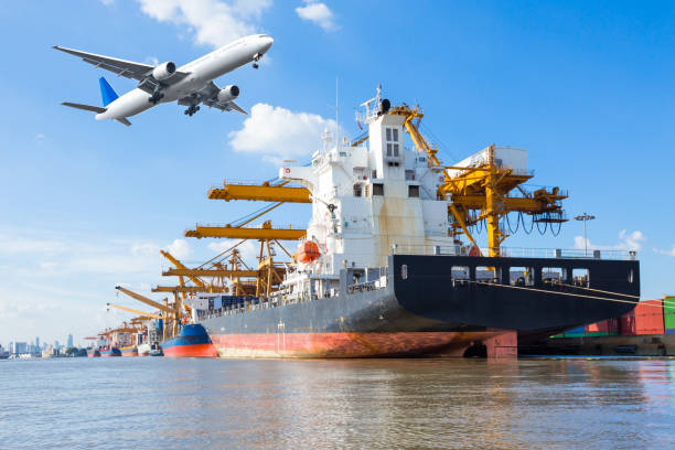 istock Cargo plane flying above ship port for logistic background 649580740