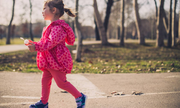 istock Little girl having fun in park 649583766