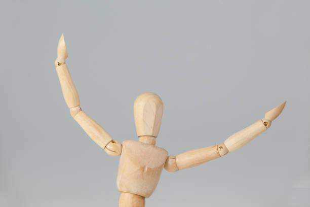 istock Wooden figurine with arms spread wide 649584574