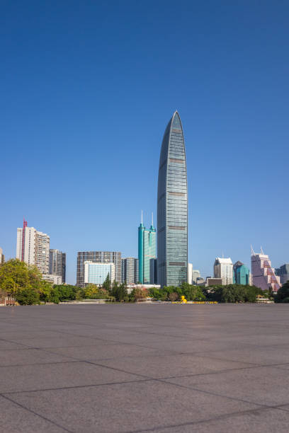 istock Under the blue sky of modern architectural skyline and blank floor 649584606
