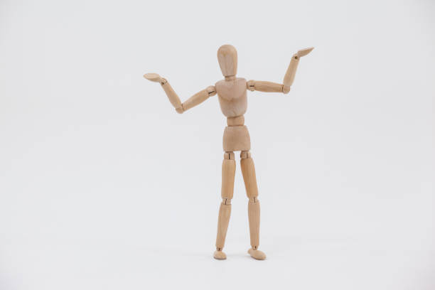 istock Wooden figurine standing with arms spread 649590568