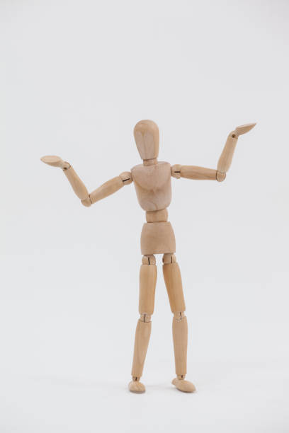 istock Wooden figurine standing with arms spread 649590676