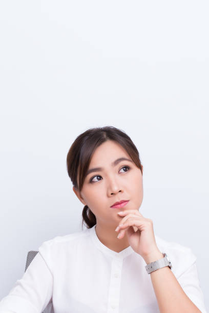 istock Asian woman thinking on isolated background 649591040