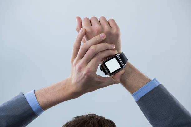 istock Businessmans hands checking his smart watch 649594168