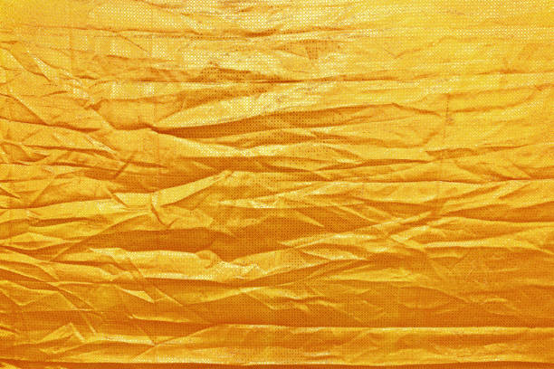 istock wrinkled gold texture for background and design 649594284