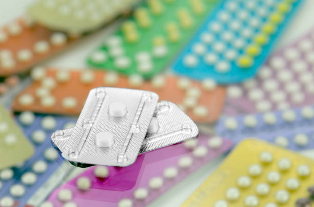 Emergency contraceptive pills. Emergency contraceptive pills on pharmacy counter with colorful pills strips background. estrogen photos stock pictures, royalty-free photos & images