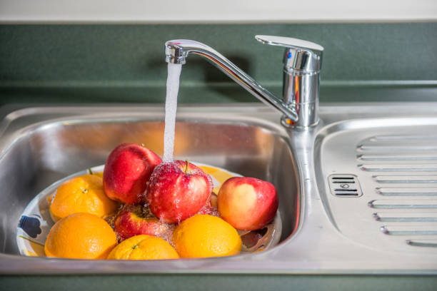 istock Washing fruits 649597198
