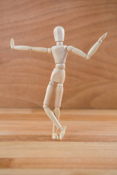 istock Wooden figurine posing with arms spread 649597608