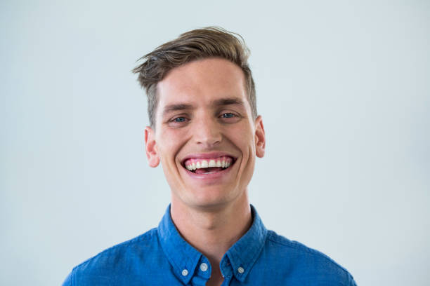istock Close-up of smiling man in blue shirt 649601100