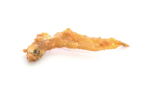 istock Closeup fried little fish isolated on white background with clipping path 649608372