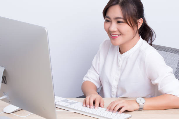 istock Asian woman show her smile at office 649612110