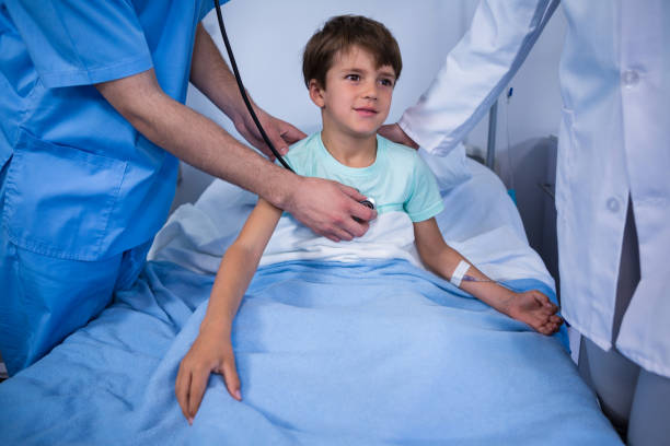 istock Doctors examining patient in ward 649615298