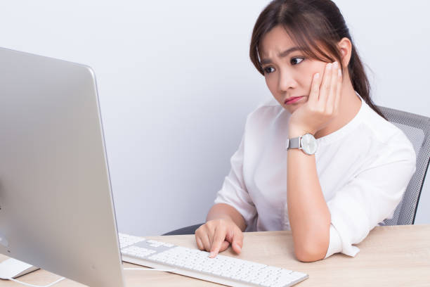 istock Woman use the computer and she feel boring 649615968