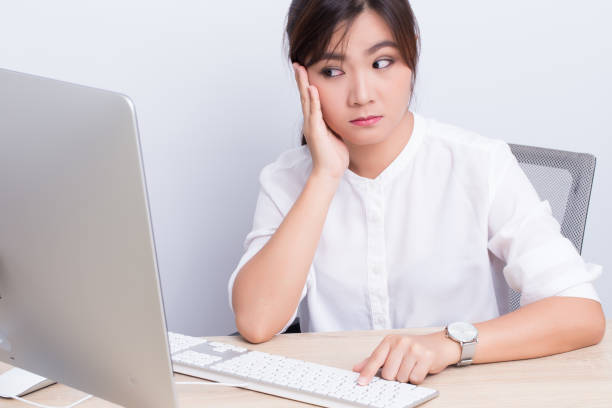 istock Woman use the computer and she feel boring 649618360