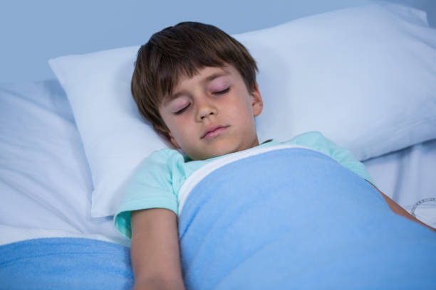 istock Patient relaxing on bed in ward 649618622