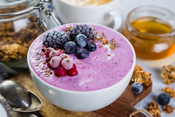 istock Breakfast - yogurt bowl with granola and berries, coffee, honey 649618872