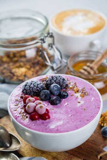 istock Breakfast - yogurt bowl with granola and berries, coffee, honey 649618910