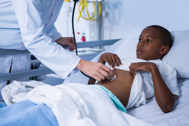 istock Doctor examining patient with stethoscope in ward 649618988