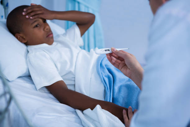 istock Doctor checking patient fever during visit in ward 649619018