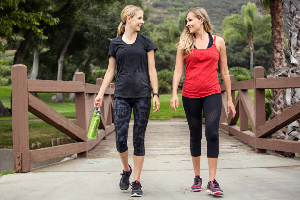 istock Two Women Walking and working out Together 649619246