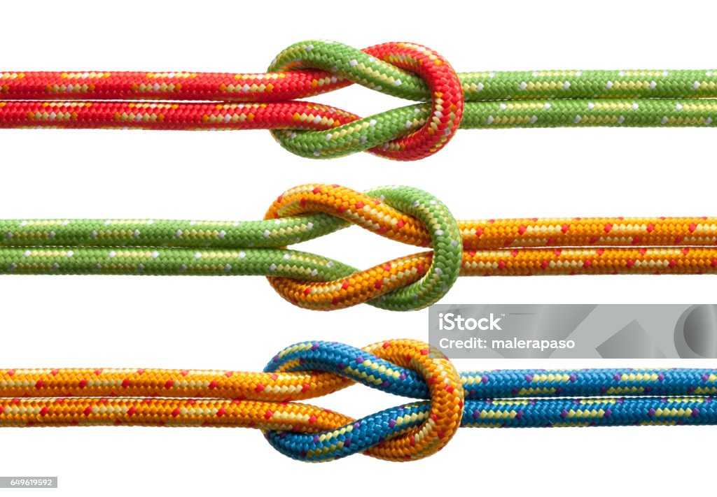 Knots with colored ropes Knots with ropes of different colors. Agreement Stock Photo