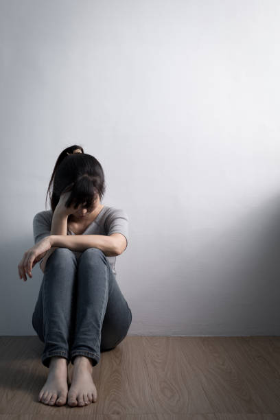 istock depression woman sit on floor 649625002