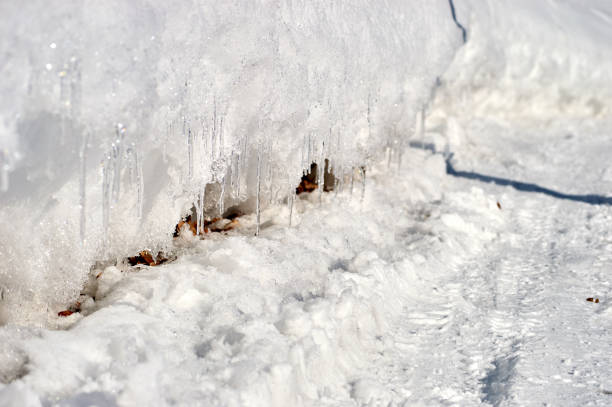istock many icicles melt on the winter road 649633118