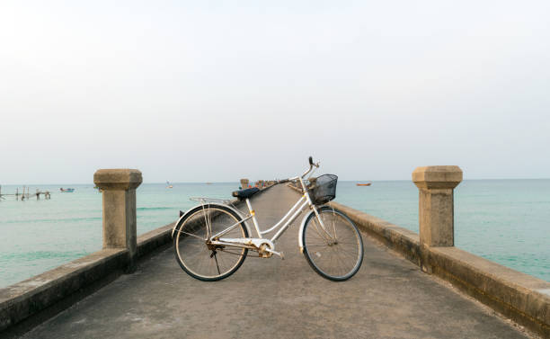 istock Bicycles parked on a bridge in the sea. 649634318
