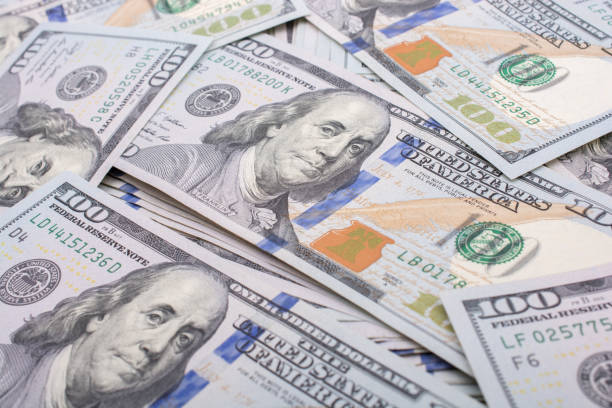 istock Banknotes of US dollar spread around 649642904