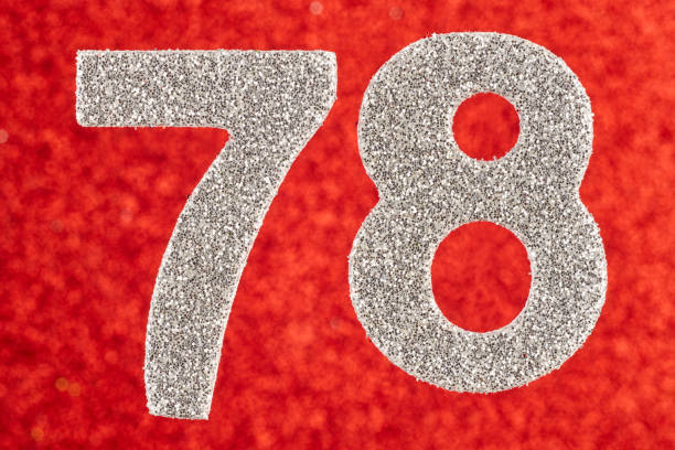 istock Number seventy-eight silver color over a red background. Anniversary. 649643220