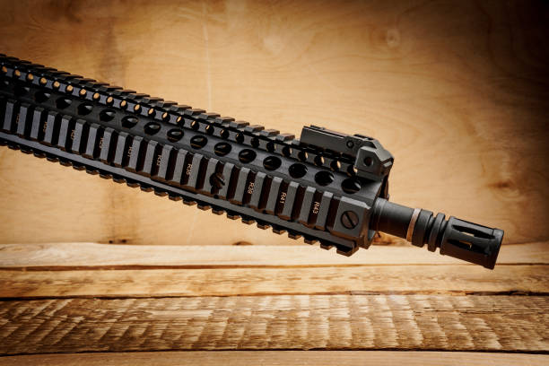 istock assault rifle on a wooden table 649643408