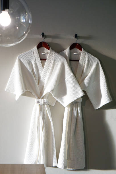 istock Couple White bathrobe in wooden wardrobe 649645830