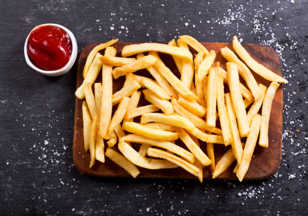 istock French fries with ketchup on dark table 649646146