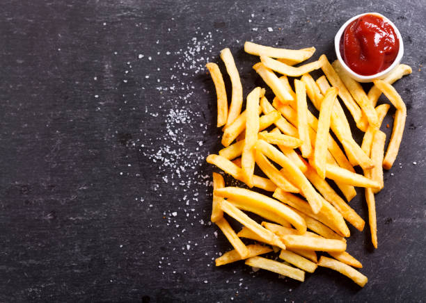 istock French fries with ketchup on dark table 649646162