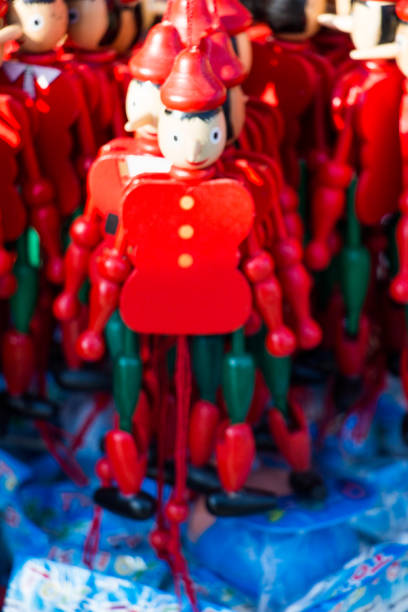 istock Wooden pinocchio dolls with his long nose 649646378