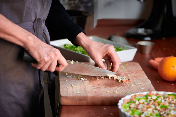 istock Housewife preparing a meal in her kitchen 649650818