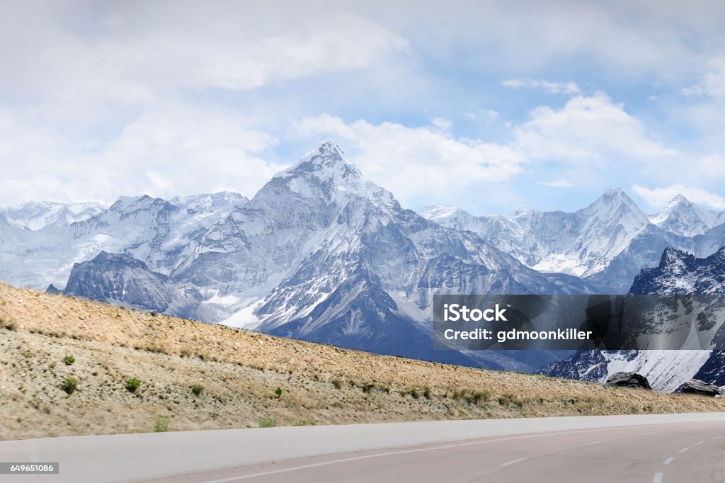 snowcapped mountain and road peaks of snowcapped mountains and highway road Autumn Stock Photo